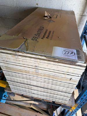a stack of boxes sitting on a pallet in a warehouse