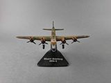 the model airplane is sitting on a black stand on a gray surface