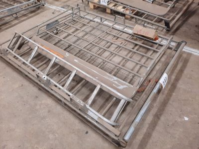 a lot of metal beds that are on the floor