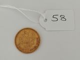 a gold coin with a price tag attached to it