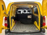 a yellow van with its doors open in a parking lot