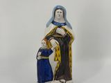 a figurine of a woman holding a child in her arms