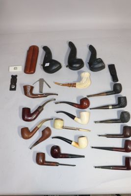 many different types of smoking pipes on the table