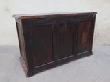 an old wooden cabinet with a door on the top