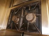 a metal stove top with two burners on it