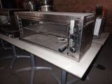 an image of a toaster oven sitting on a table