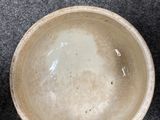 two bowls sitting next to each other on the floor