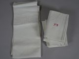 a lot of white napkins sitting on a table