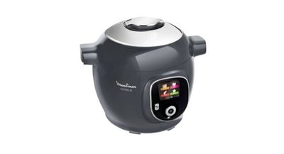 a black and silver rice cooker on a white background