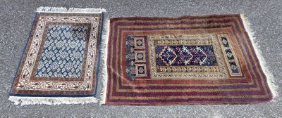 two rugs on the ground with a rug on the ground