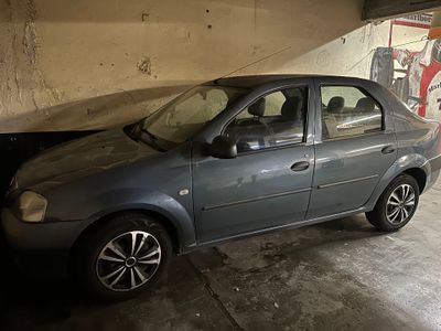 a car that is parked in a garage under a bridge
