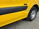 a yellow car that is parked on the side of the road