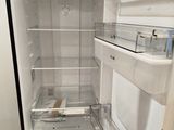 an image of an open refrigerator in a kitchen