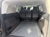 four seats in the back of a van with the door open