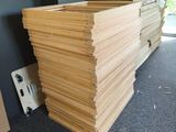 a stack of wood sitting on the floor in a room