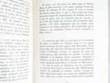 someone is holding a book open to a page with a picture on it