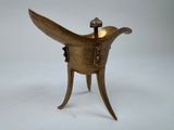 an antique brass incense burner with a bird on top of it