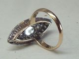 an image of a gold ring with a pearl in it