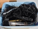 a blue container filled with different types of hair dryers