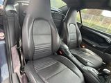 the interior of a car with black leather seats and black leather trims