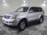 a picture of a silver suv parked in a garage