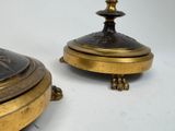 pair of antique brass candlesticks with a black and gold decoration