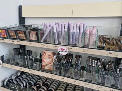 a lot of makeup products on the shelves in the store