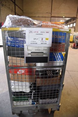 a metal cart with a bunch of items in it