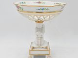 an image of a white and gold bowl with an elephant on it