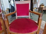a red chair that is sitting in a room