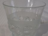 a clear glass bowl sitting on top of a white table