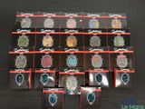 several pieces of jewelry are displayed on a black surface