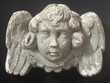 an image of a statue of an angel with wings on it ' s head