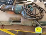 a drill on a box with a cord attached to it