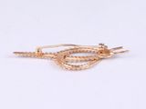 pair of gold plated earrings with a knot on each side