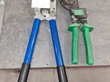 two pliers and a pair of pliers on the floor