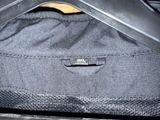a close up of a black bag with a black handle