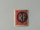 the stamp is red and black with a black r f logo on it