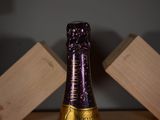 a bottle of wine that is sitting on a table