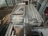 a large amount of steel bars stacked on top of each other in a warehouse