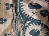 a close up of a piece of fabric with a bird on it