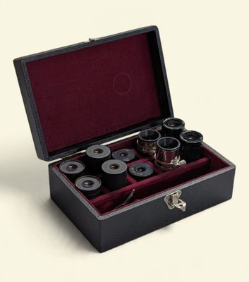 a black box with six different types of binoculars in it