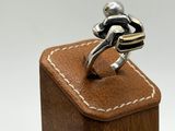 a ring that is sitting on top of a wooden box