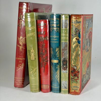 a lot of books that are sitting on a table