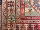 an image of a rug on the floor with a cat laying on top of it