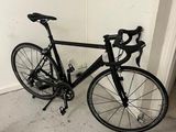 a bike that is leaning up against a wall