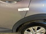 a car with a sticker on the side of it ' s door