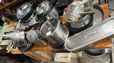 many pots and pans that are on a table