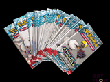 several packs of pokemon trading cards are stacked on top of each other