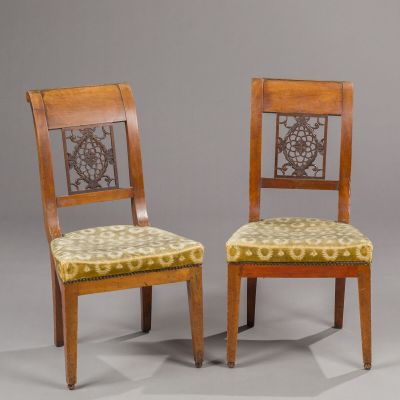 pair of chairs in the manner of person